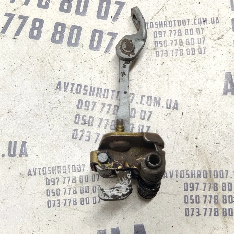 Обмежувач дверей Dacia Logan 04-12 1.6 бенз ліва OEM 214078d