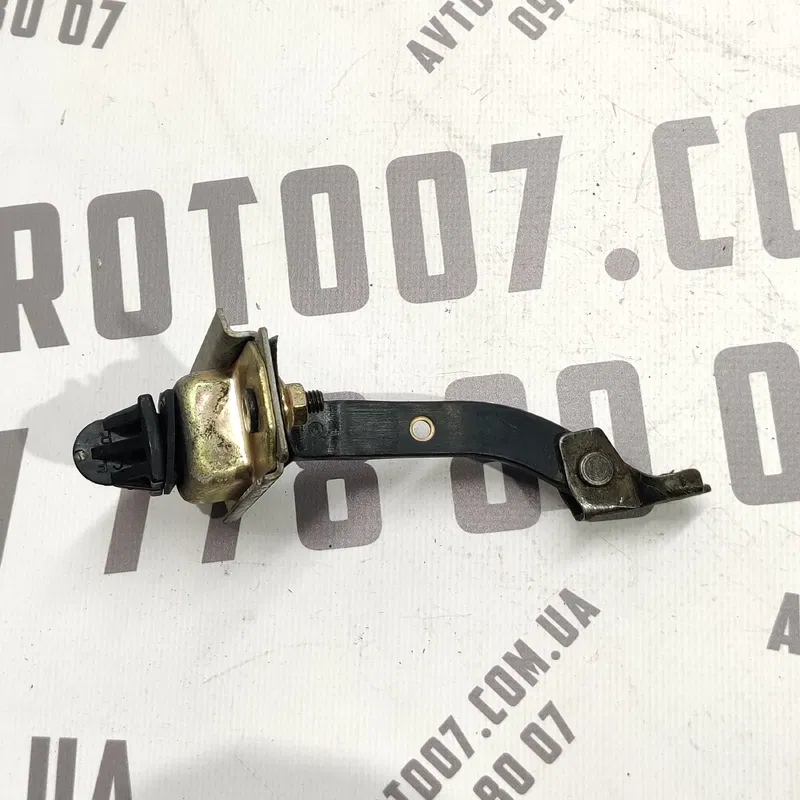 Обмежувач дверей Mazda Premacy (99-05) 1.8 бенз передня ліва