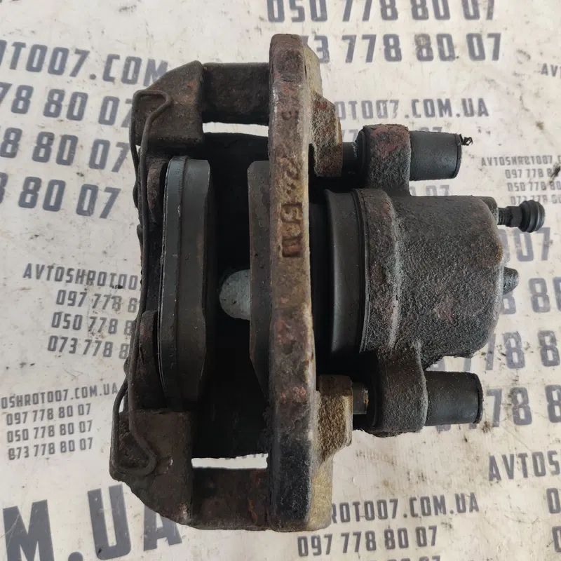 Тормозний супорт передній лівий Mazda 3 BK (03-09)