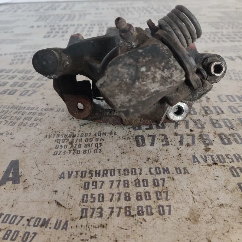 Тормозний супорт Mazda 3 BK (03-09) зад. лівий OEM 15F0M000