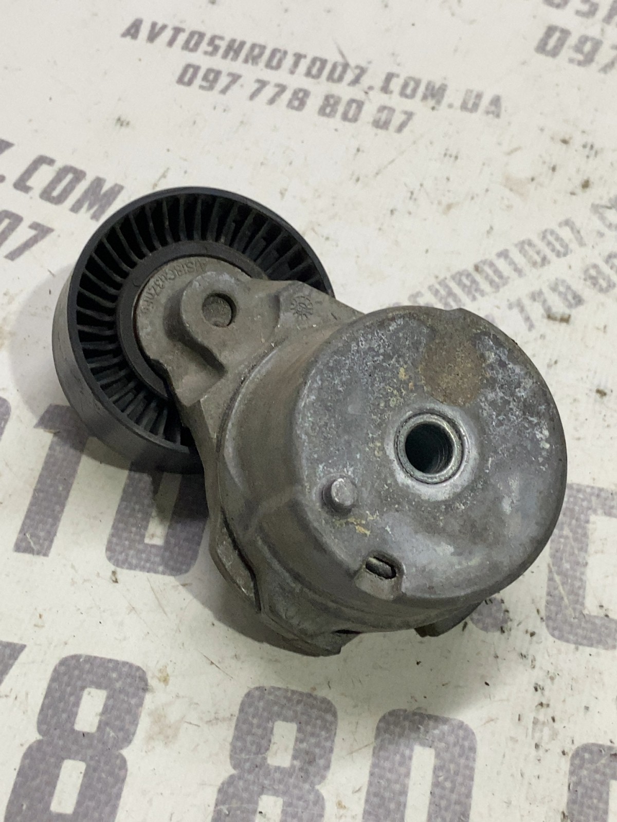 Ролик-натяжник ремня лівий Ford F-150 (09-14) 7448974