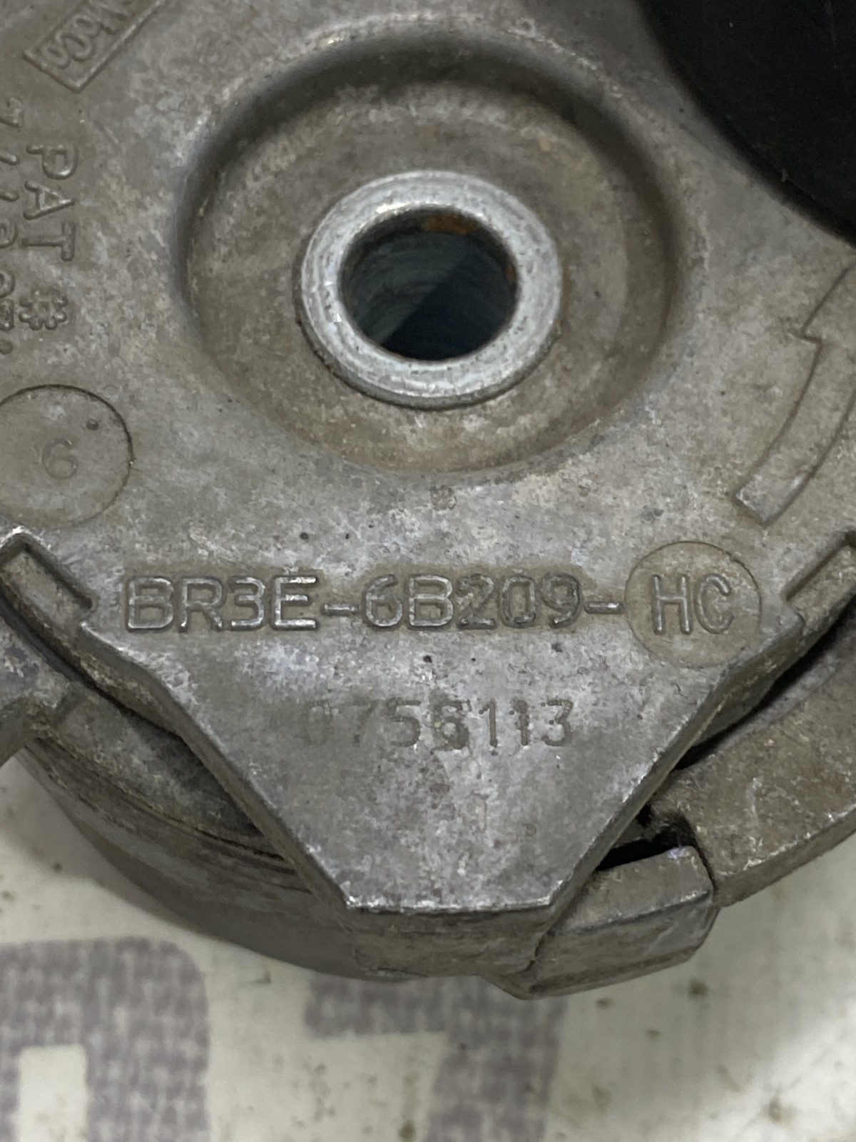 Ролик-натяжник ремня лівий Ford F-150 (09-14) 7448974