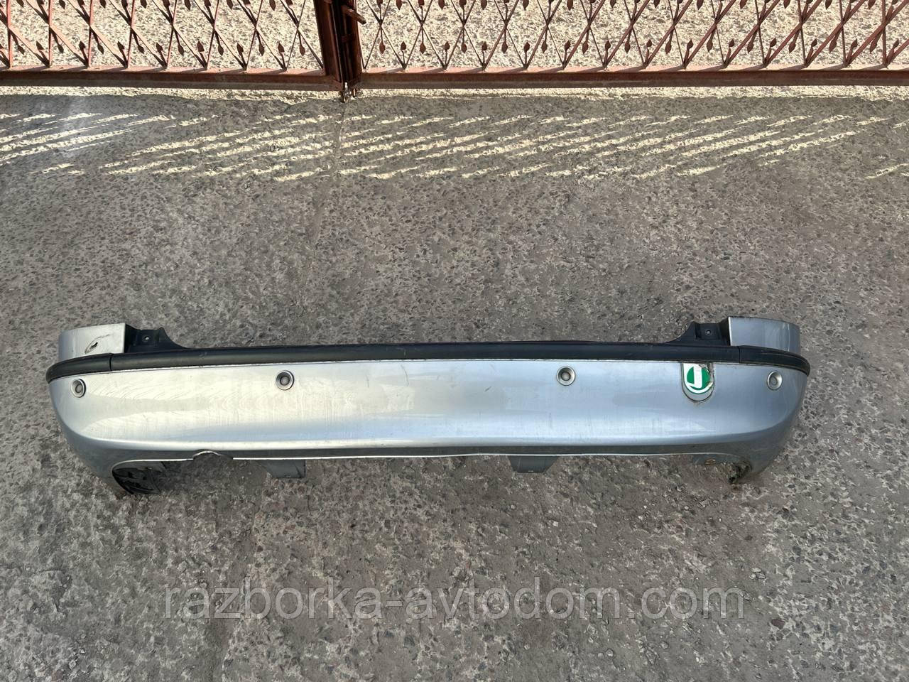 Бампер задній (з парктроніками) Opel Zafira A OE:90580820