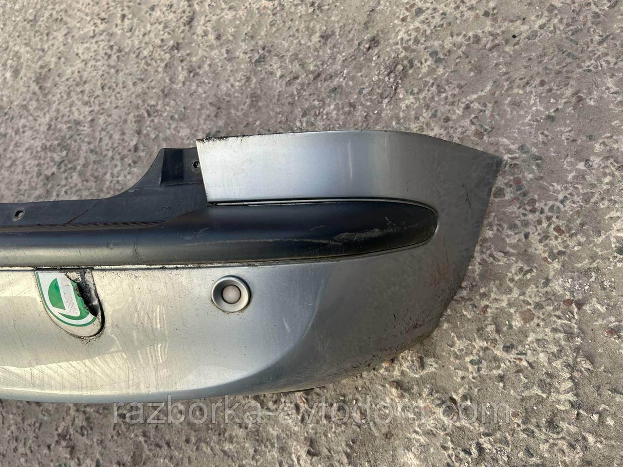 Бампер задній (з парктроніками) Opel Zafira A OE:90580820